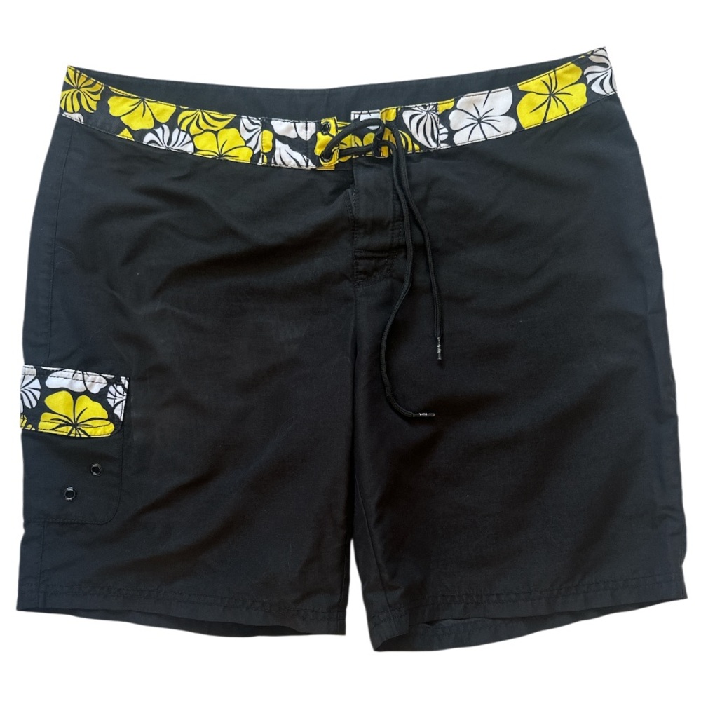 Lilu black board shorts with a yellow and white floral waistband and pocket trim